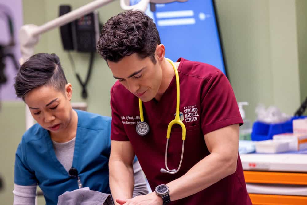 Chicago Med Season 11 Episode 20 -- "Hell Breaks Loose" Episode 1120 -- Pictured: Darren Barnet as Dr. John Frost -- (Photo by: George Burns Jr/NBC)