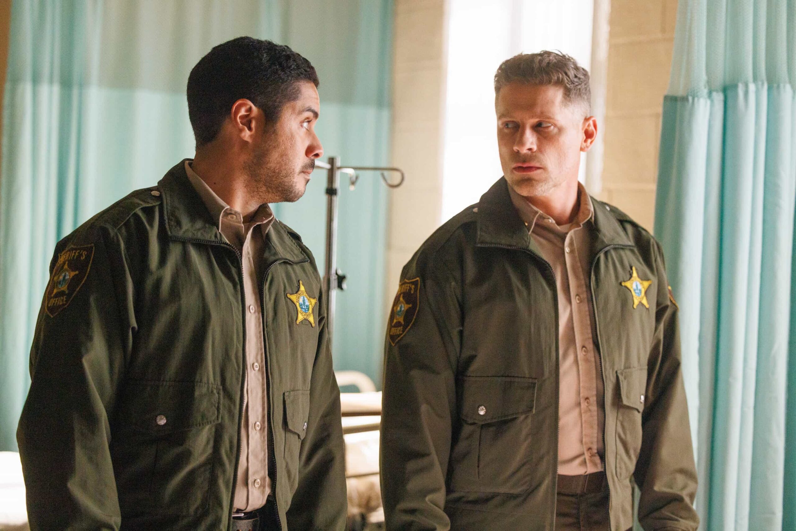 Sheriff Country Season 1 Episode 18  “The Gambler” – A dramatic federal crackdown rocks Edgewater and forces Sheriff Mickey Fox to confront a sprawling investigation that pits loyalty to her community against the reach of the DEA. The case pushes Mickey closer to home than ever before with consequences for the people she loves the most, on SHERIFF COUNTRY, Friday, May 8 (8:00-9:00 PM, ET/PT) on the CBS Television Network, and streaming on Paramount+ (live and on-demand for Paramount+ Pictured: Ian Quinlan as Hank and Matt Lauria as Boone. Photo: Darren Goldstein/CBS ©2026 CBS Broadcasting, Inc. All Rights Reserved.