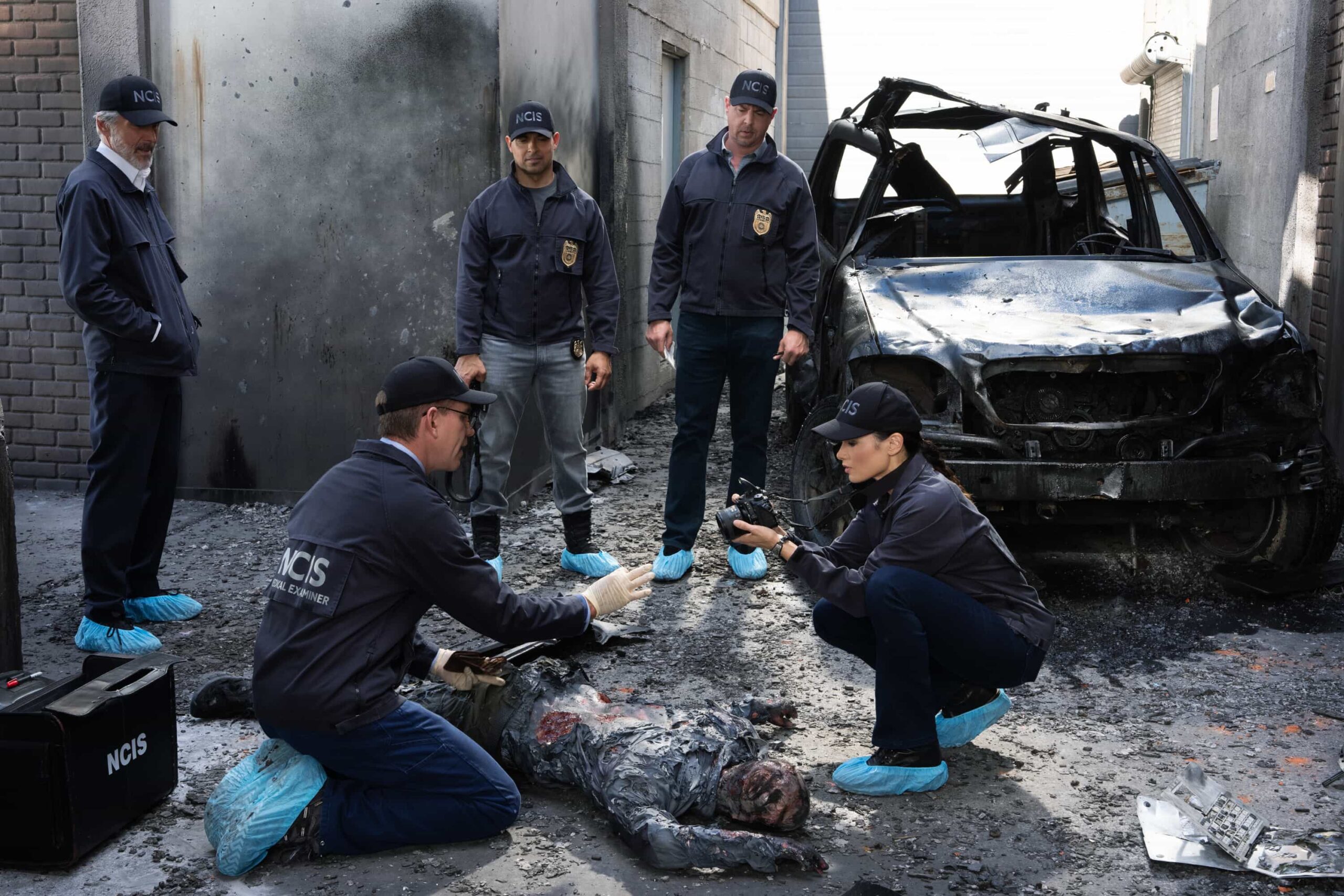“SONS AND DAUGHTERS” - CBS Original Series NCIS, scheduled to air TUESDAY, MAY 12 (8:00 PM ET/PT)  Pictured (L-R): Sean Murray as Timothy McGee, Gary Cole as Alden Parker, Wilmer Valderrama as Nick Torres, Katrina Law as Jessica Knight, Brian Dietzen as Jimmy Palmer   Photo: Robert Voets/CBS  ©2026 CBS Broadcasting, Inc. All Rights Reserved.
