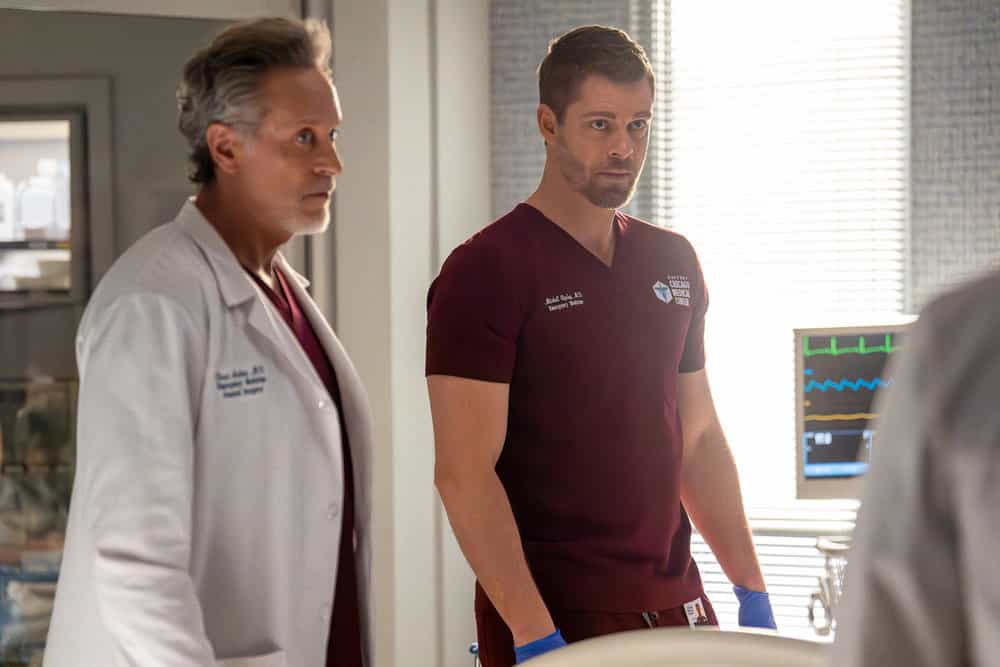 Chicago Med Season 11 Episode 21 Season Finale -- "Heaven Help Us" Episode 1121 -- Pictured: (l-r) Steven Weber as Dr. Dean Archer, Luke Mitchell as Dr. Mitch Ripley -- (Photo by: Peter Gordon/NBC)
