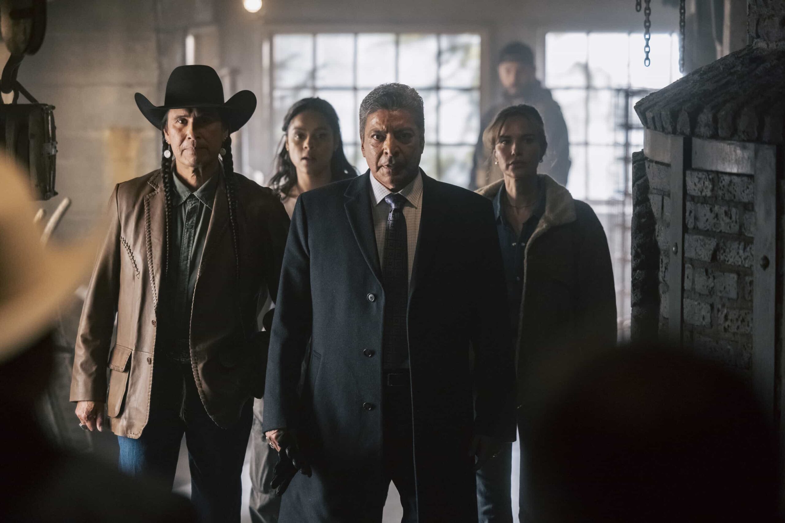 "Wolves at the Door" -- CBS Original Series MARSHALS, scheduled to air on Sunday, May 24 (8:00-9:00 PM, ET/PT).  Pictured (L-R): Mo Brings Plenty, Gil Birmingham as Thomas Rainwater, and Arielle Kebbel as Belle. Photo: Fred Hayes/CBS ©2025 CBS Broadcasting, Inc. All Rights Reserved.