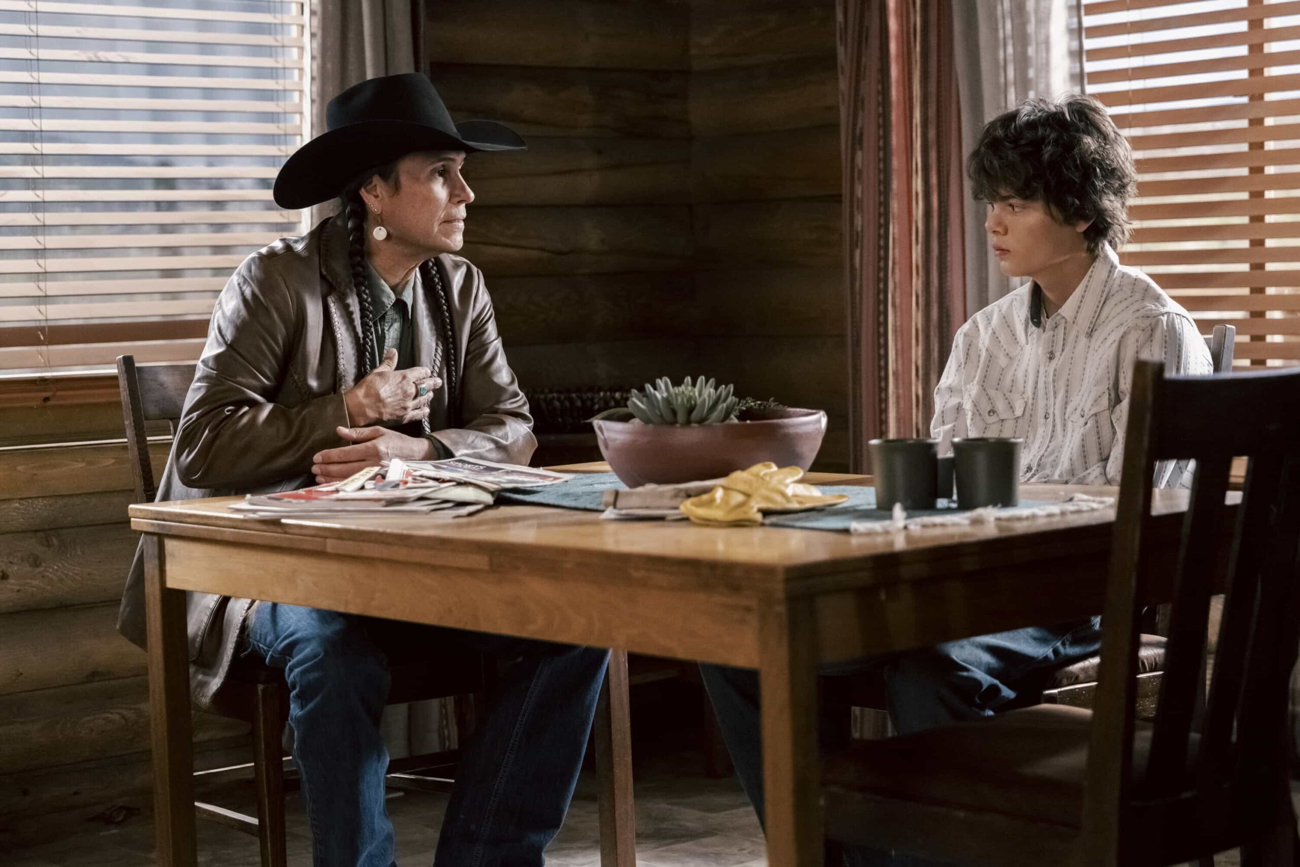 "Wolves at the Door" -- CBS Original Series MARSHALS, scheduled to air on Sunday, May 24 (8:00-9:00 PM, ET/PT).  Pictured (L-R): Mo Brings Plenty and Brecken Merrill as Tate Dutton. Photo: Fred Hayes/CBS ©2025 CBS Broadcasting, Inc. All Rights Reserved.
