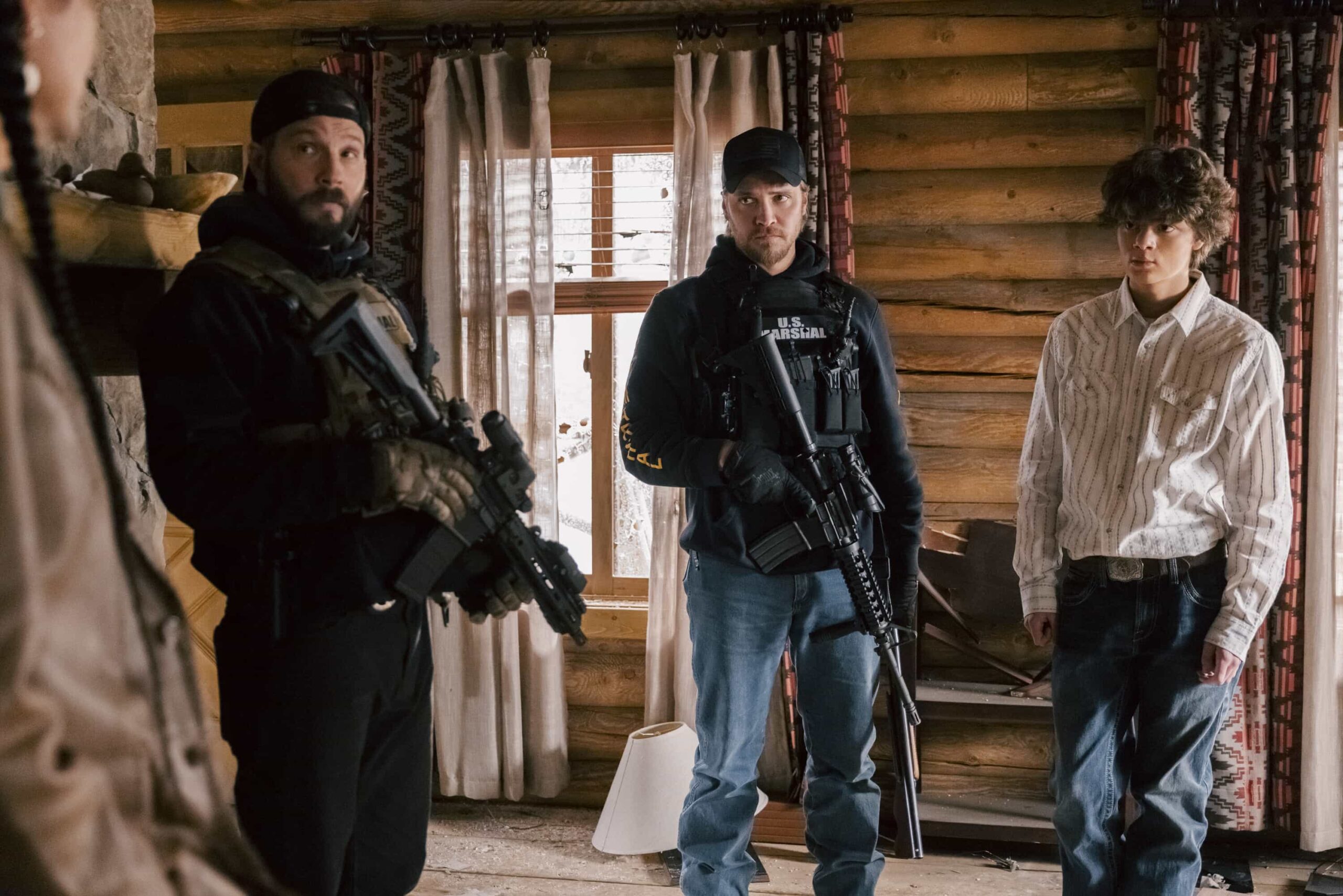 Marshals Season 1 Episode 13 "Wolves at the Door" Season Finale -- CBS Original Series MARSHALS, scheduled to air on Sunday, May 24 (8:00-9:00 PM, ET/PT).  Pictured (L-R): Logan Marshall-Green as Pete Calvin, Luke Grimes as Kayce Dutton, and Brecken Merrill as Tate Dutton. Photo: Fred Hayes/CBS ©2025 CBS Broadcasting, Inc. All Rights Reserved.