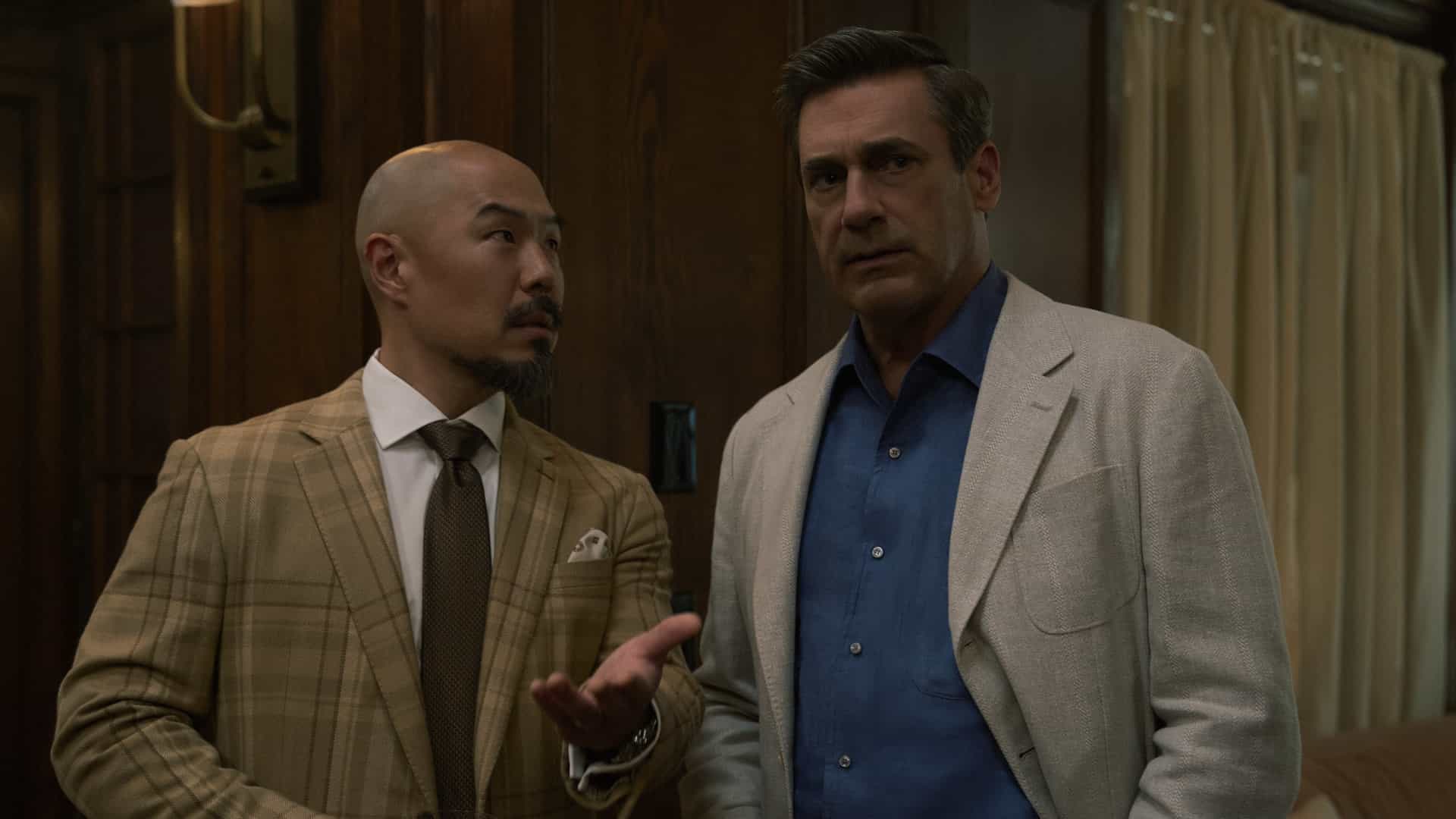 YOUR FRIENDS & NEIGHBORS Season 2 Episode 10 Finale Photos “The Night of the Hunter” 10 Hoon Lee and Jon Hamm in "Your Friends & Neighbors," now streaming on Apple TV.