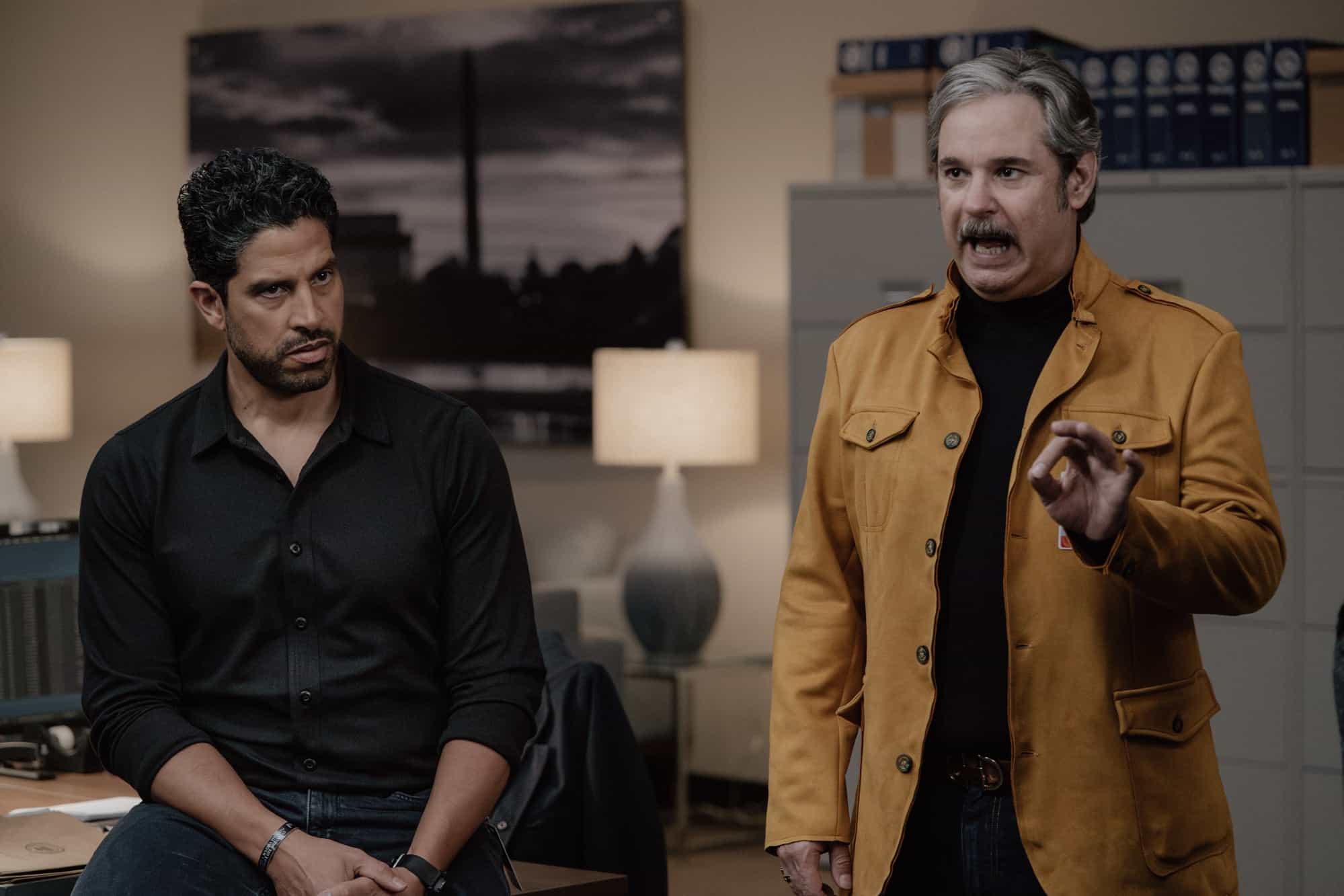 Adam Rodriguez as Luke Alvez and Paul F. Tompkins as Brian Garrity in Criminal Minds: Evolution, episode 6, season 19  streaming on Paramount+, 2026.  CREDIT:  Michael Yarish/Paramount+ © 2026 ABC Studios Inc. and CBS Studios Inc. All Rights Reserved.