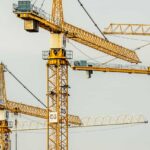 yellow tower cranes