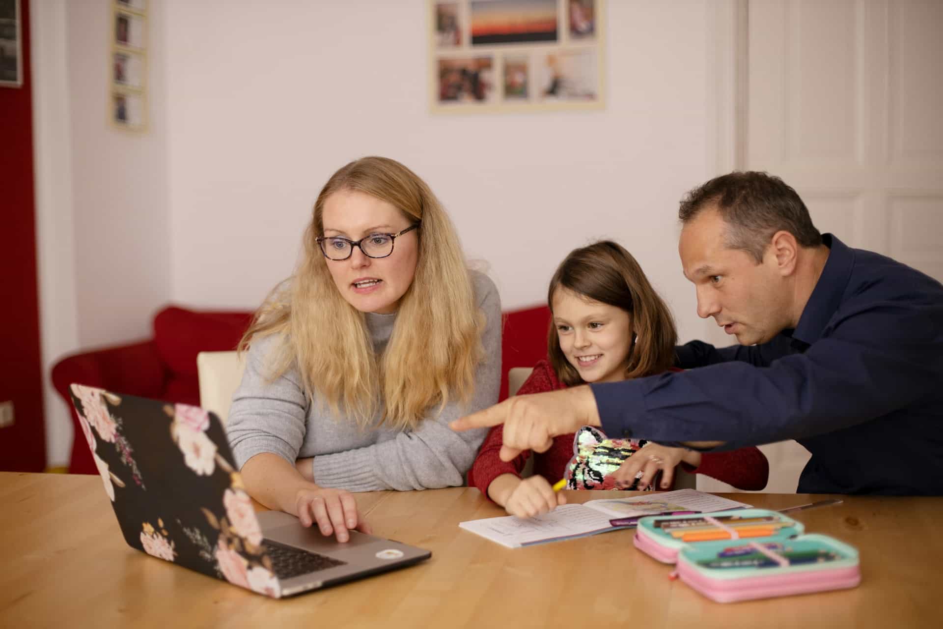 family looking at computer