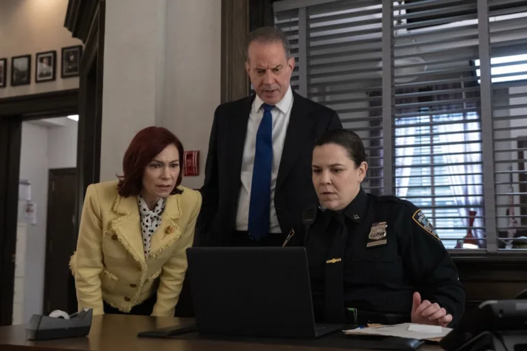 "Crazy in Love" -- Coverage of the CBS Original Series Elsbeth, scheduled to air on the CBS Television Network.   Pictured (L-R): Carrie Preston as Elsbeth Tascioni, Danny Mastrogiorgio as Detective Smullen, and Lindsay Mendez as Officer Grace Hackett.  Photo: Michael Parmelee/CBS ©2026 CBS Broadcasting, Inc. All Rights Reserved.