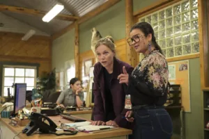 Ep# 106 - "There's Always a Road" - Tracy Spiridakos as Anna Pigeon and Crystle Lightning as Frieda in Anna Pigeon on th USA NETWORK. Photo credit: Michelle Faye/USA Network © VERSANT MEDIA 2025. All Rights Reserved
