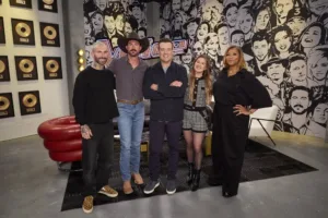 THE VOICE -- "Blind Auditions" Episode 3002 -- Pictured: (l-r) Adam Levine, Riley Green, Carson Daly, Kelly Clarkson, Queen Latifah -- (Photo by: Trae Patton/NBC)