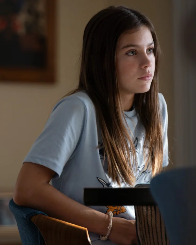 Sofia (Mélodie Rose Romano) listens at the dining table in R.J. Decker Season 2 Episode 4, “The Angler.”