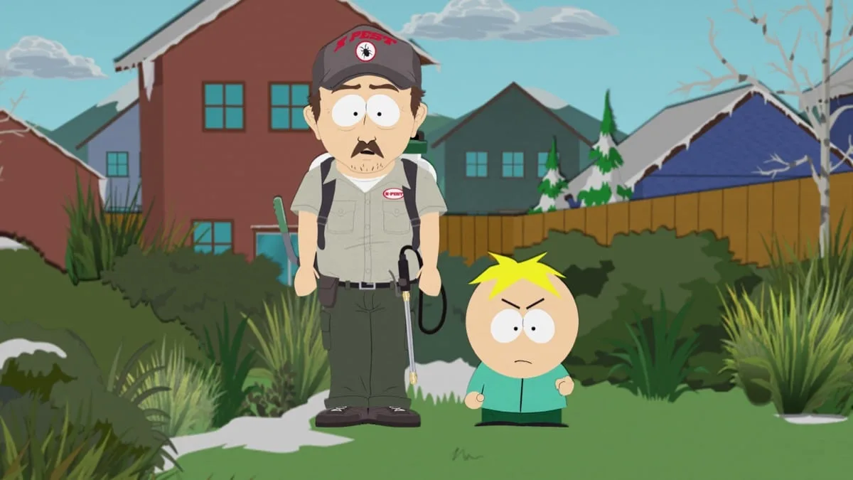 Butters holds a sheet of paper in front of his classmates while Mr. Garrison watches in South Park Season 29 Episode 2, “Billionaire Weenietown.”