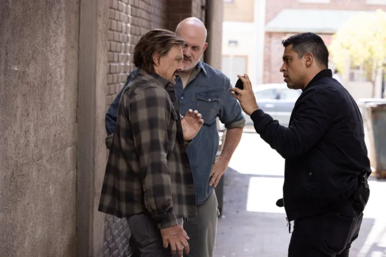 "Sleeping Dogs" -- Coverage of the CBS Original Series NCIS, scheduled to air on the CBS Television Network. Pictured (L to R): Lucius Baybak as Michael “Mickey” Fallon, Mike O’Malley as Walt Keller, Wilmer Valderrama as Nicholas “Nick” Torres. Photo: Sonja Flemming/CBS ©2026 CBS Broadcasting, Inc. All Rights Reserved.