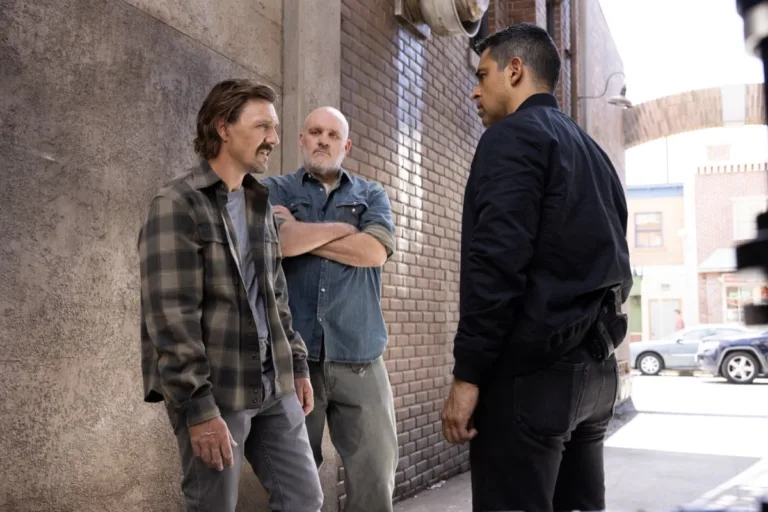 NCIS Season 24 Episode 3 "Sleeping Dogs" -- Coverage of the CBS Original Series NCIS, scheduled to air on the CBS Television Network. Pictured (L to R): Lucius Baybak as Michael “Mickey” Fallon, Mike O’Malley as Walt Keller, Wilmer Valderrama as Nicholas “Nick” Torres. Photo: Sonja Flemming/CBS ©2026 CBS Broadcasting, Inc. All Rights Reserved.