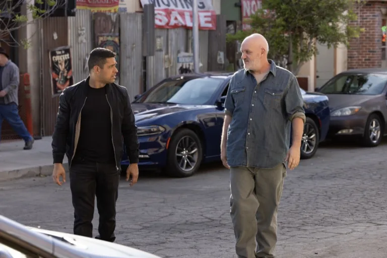 "Sleeping Dogs" -- Coverage of the CBS Original Series NCIS, scheduled to air on the CBS Television Network. Pictured (L to R): Wilmer Valderrama as Nicholas “Nick” Torres, Mike O’Malley as Walt Keller Photo: Sonja Flemming/CBS ©2026 CBS Broadcasting, Inc. All Rights Reserved.