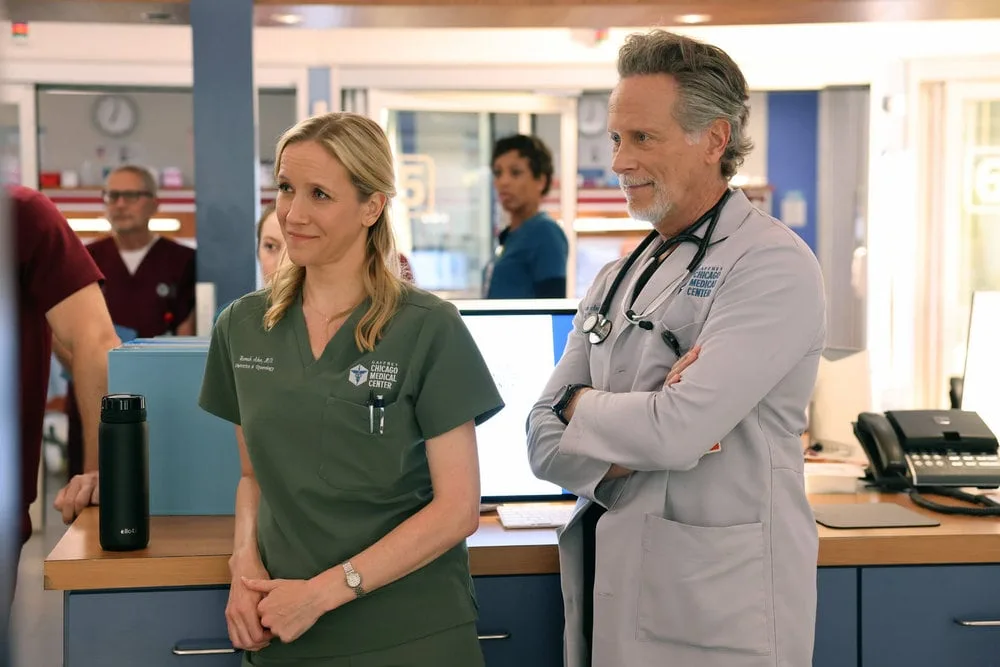 Chicago Med Season 12 Episode 3 -- "They Call Me Ms. Goodwin" Episode 1203 -- Pictured: (l-r) Jessy Schram as Dr. Hannah Asher, Steven Weber as Dr. Dean Archer -- (Photo by: George Burns Jr/NBC)